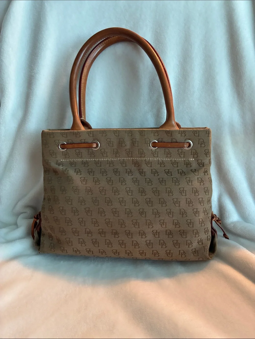 Dooney & Bourke  Brown Monogram Handbag with Tassel Accent